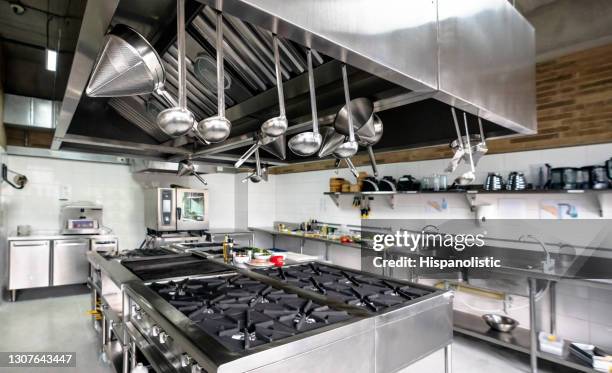 wide angle view of a commercial kitchen - restaurant kitchen stock pictures, royalty-free photos & images