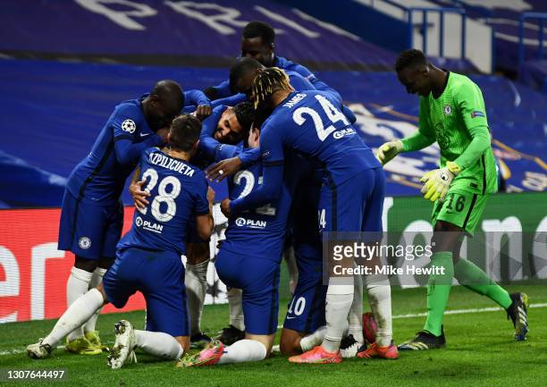 Emerson Palmieri of Chelsea celebrates with teammates after scoring their team's second goal during the UEFA Champions League Round of 16 match...