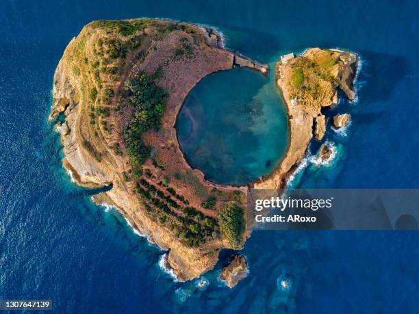 bird eye view, aerial panoramic view. top view of islet of vila franca do campo is formed by the crater of an old underwater volcano near sao miguel island, azores, portugal. - ponta delgada stock pictures, royalty-free photos & images