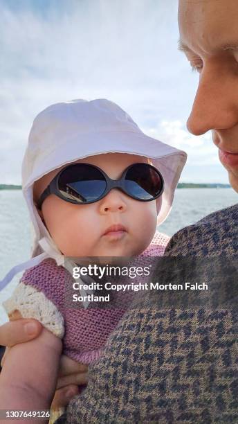 baby wearing hat and sunglasses - akershus festning stock pictures, royalty-free photos & images