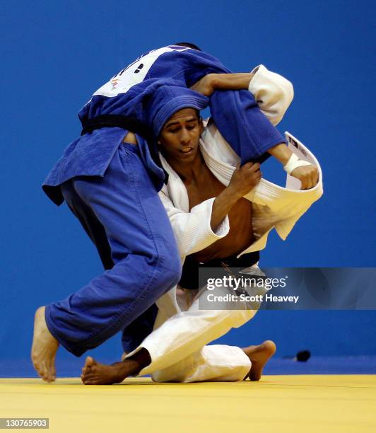 Juan Miguel Postigos of Peru in action with Kenny Godoy of Honduras during Men's Judo -60KG at the Code II Gymnasium during the XVI Pan American...