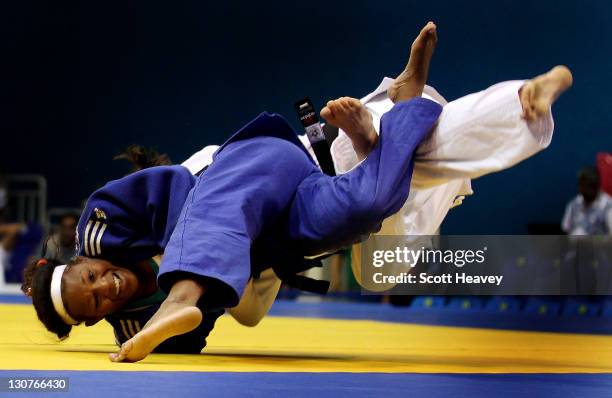 Yanet Burmoy of Cuba throws Angelica Delgado to win their match in the Women's Judo -52KG at the Code II Gymnasium during the XVI Pan American Games...