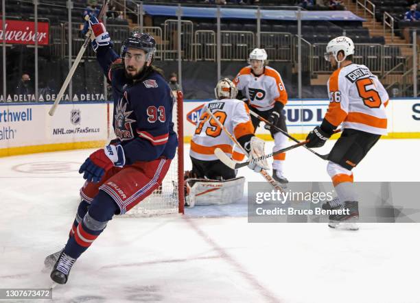 Mika Zibanejad of the New York Rangers celebrates his power-play goal at 14:29 of the second period against Carter Hart of the Philadelphia Flyers at...