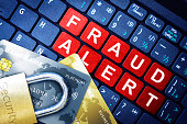 Fraud Alert Concept With Security Lock on Fake Credit Cards