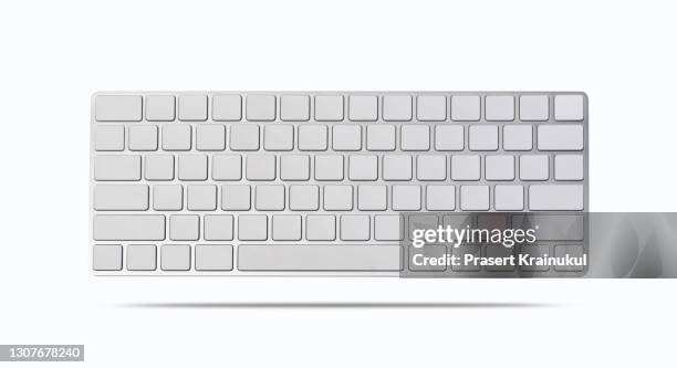 modern aluminum computer keyboard isolated on white background - computertastatur stock-fotos und bilder