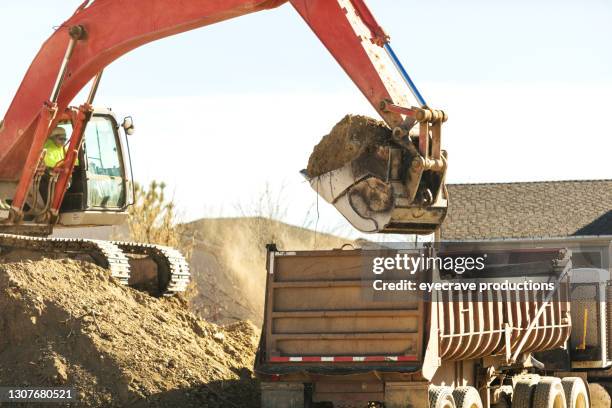 heavy machinery construction zone work excavator western usa photo series - archeologia foto e immagini stock