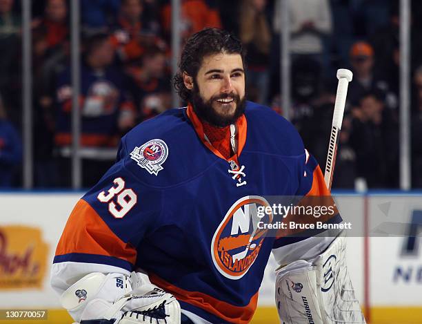 Rick DiPietro of the New York Islanders skates out to face the San Jose Sharks at Nassau Veterans Memorial Coliseum on October 29, 2011 in Uniondale,...