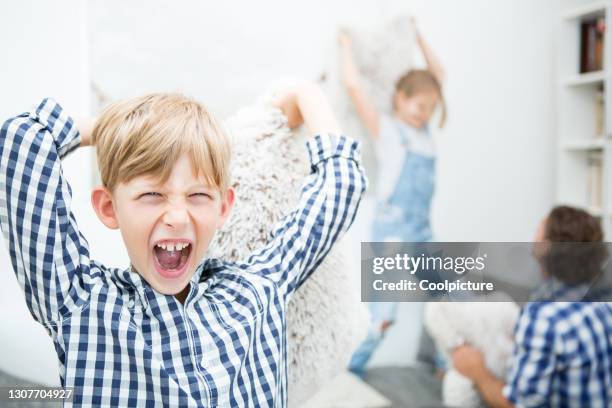 boy with pillow screaming. - father and child and pillow fight stock pictures, royalty-free photos & images