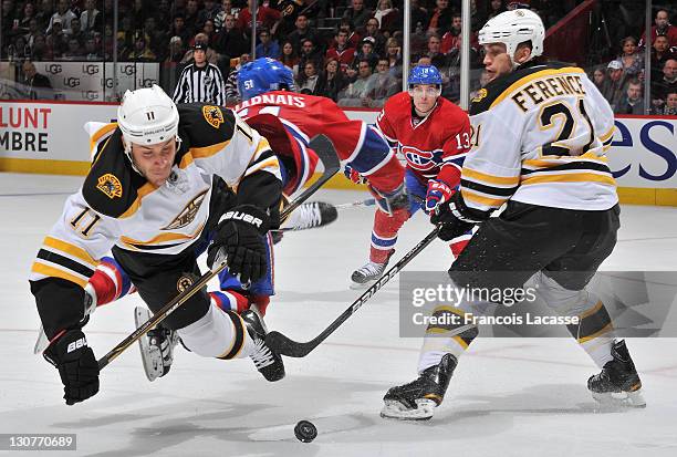 Gregory Campbell of the Boston Bruins collides with David Desharnais of the Montreal Canadiens during the NHL game on October 29, 2011 at the Bell...