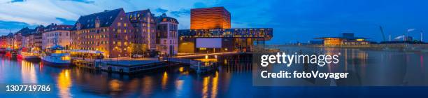 copenhagen nyhavn bars restaurants illuminated at dusk panorama denmark - nyhavn stock pictures, royalty-free photos & images