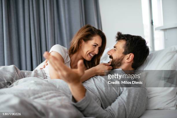 start every morning with love. stock photo - couples in bed stock pictures, royalty-free photos & images
