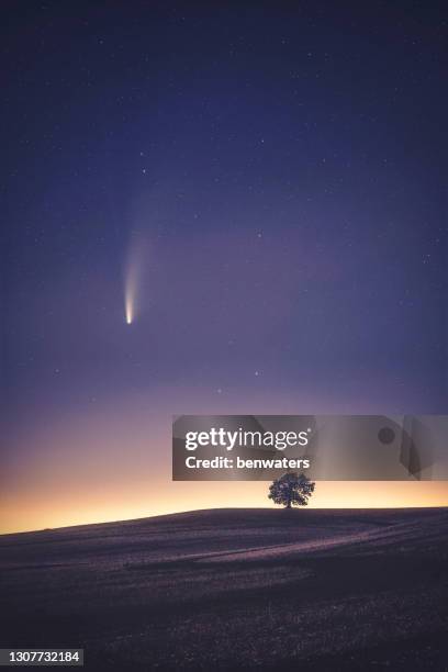 comet neowise over rural landscape at night, warwickshire, england, uk - meteorite stock pictures, royalty-free photos & images