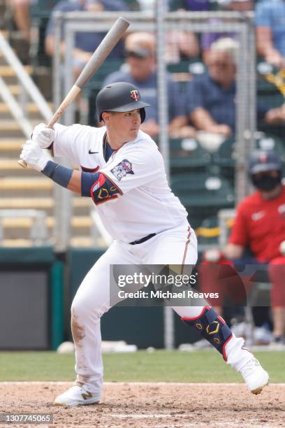 Jose Miranda of the Minnesota Twins in action against the Boston Red Sox during a Grapefruit League spring training game at Hammond Stadium on March...