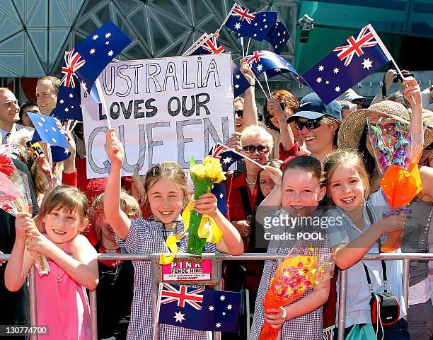 Commonwealth-summit-Australia-royals-republic,FOCUS by Neil Sands This photo taken on October 26, 2011 shows schoolchildren waving flags to support...