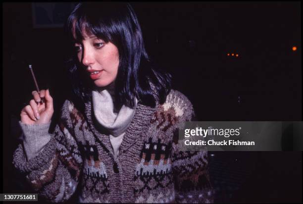 View of American actress Shelley Duvall, a cigarette in her hand, at Elaine's Restaurant, New York, New York, November 1977. She was there for a...