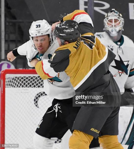 Logan Couture of the San Jose Sharks and Jonathan Marchessault of the Vegas Golden Knights fight in the third period of their game at T-Mobile Arena...