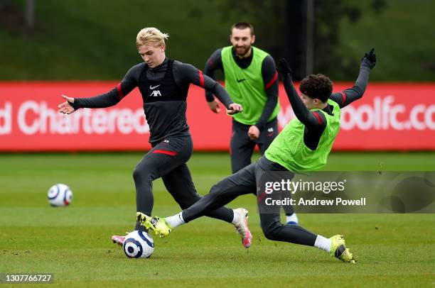 Luis Longstaff and Neco Williams of Liverpool during a training session at AXA Training Centre on March 18, 2021 in Kirkby, England.