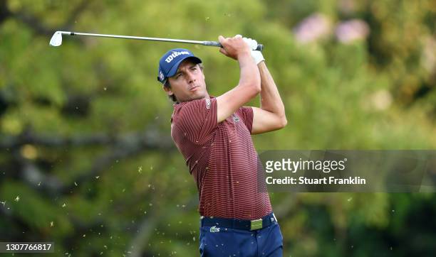 Benjamin Hébert of France plays his approach shot on the 17th hole during Day One of the Magical Kenya Open at Karen Country Club on March 18, 2021...