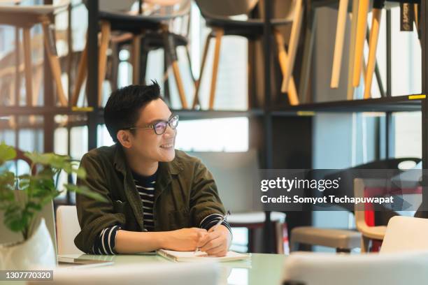 smart confidence asian startup entrepreneur business owner businessman smile woking in office background - chinese businessman stock-fotos und bilder
