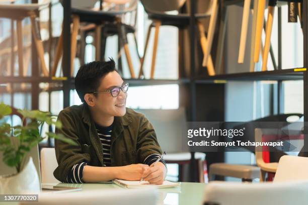 smart confidence asian startup entrepreneur business owner businessman smile woking in office background - chinese person stockfoto's en -beelden