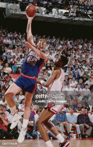 Bill Laimbeer, Center for the Detroit Pistons makes a one handed shot to the basket during the NBA Central Division basketball game against the...