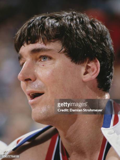 Bill Laimbeer, Center for the Detroit Pistons dribbles the basketball around Tim Kempton of the Denver Nuggets during their NBA Midwest Division...