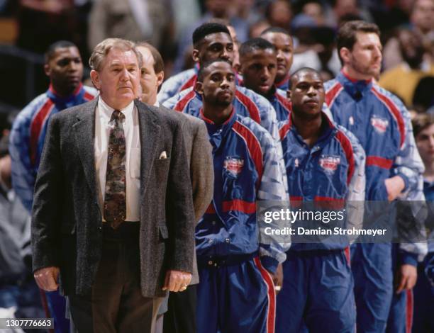 Bill Fitch, Head Coach for the New Jersey Nets lines up with his players during the NBA Atlantic Division basketball game against the Chicago Bulls...