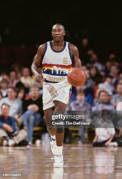 Walter Davis, Shooting Guard and Small Forward for the Denver Nuggets dribbles the basketball during the NBA Midwest Division basketball game against...