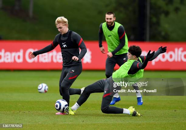 Luis Longstaff and Neco Williams of Liverpool during a training session at AXA Training Centre on March 18, 2021 in Kirkby, England.