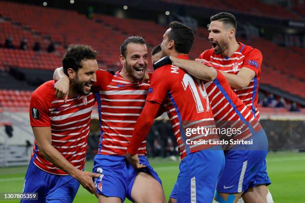 Roberto Soldado of Granada CF celebrates his goal with teammates during the UEFA Europa League Round of 16 Second Leg match between Molde and Granada...