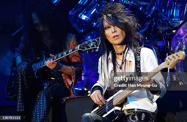 Japanese guitarist Heath of the band X Japan performs live during a concert at Olympic Gymnasium on October 28, 2011 in Seoul, South Korea.