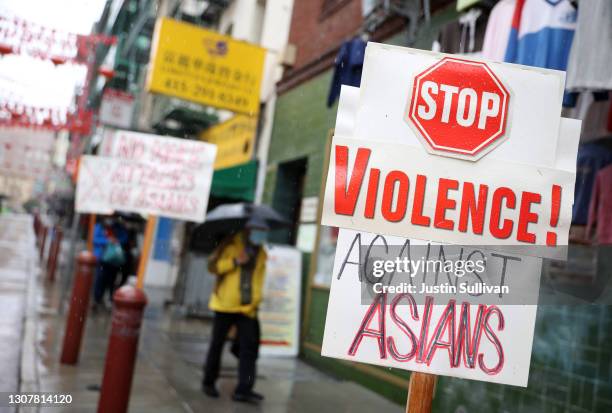 Signs against violence against Asians is posted in front of a store in Chinatown on March 18, 2021 in San Francisco, California. The San Francisco...