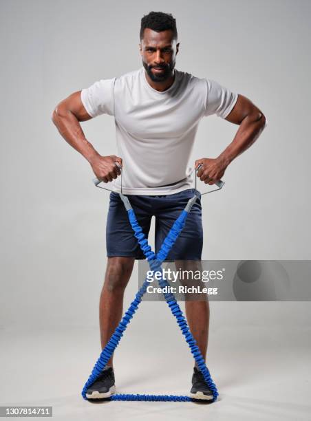 physically fit man in a studio - physically active stock pictures, royalty-free photos & images