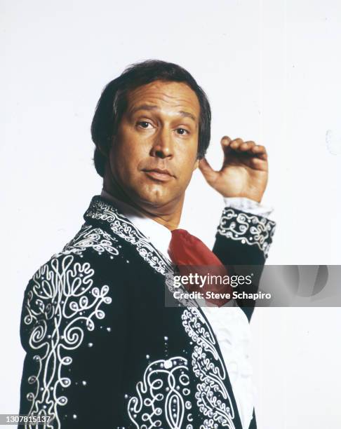 Portrait of American actor and comedian Chevy Chase as he poses, in costume for the film 'The Three Amigos' , against a white background, Simi...