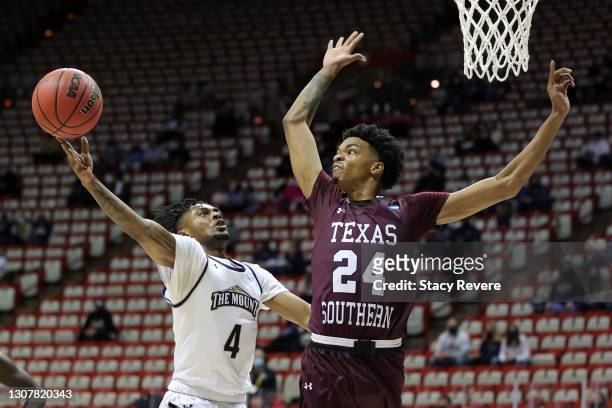 Deandre Thomas of the Mount St. Mary's Mountaineers shoots against John Walker III of the Texas Southern Tigers during the first half in a First Four...