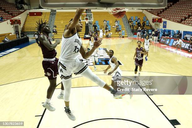 Mezie Offurum of the Mount St. Mary's Mountaineers dunks past Yahuza Rasas of the Texas Southern Tigers during the first half in a First Four game...