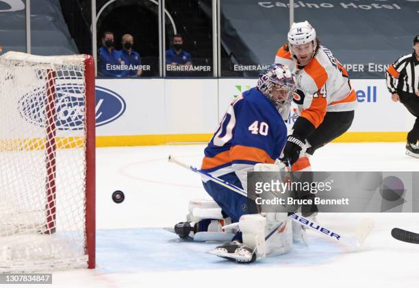 Semyon Varlamov of the New York Islanders makes the first period stop on Sean Couturier of the Philadelphia Flyers at the Nassau Coliseum on March...