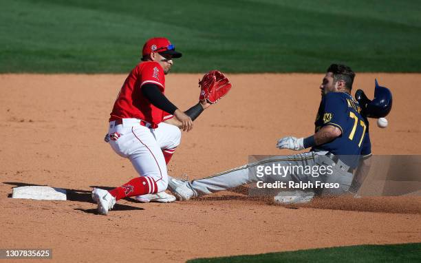 Garrett Mitchell of the Milwaukee Brewers steals second base head of the throw to shortstop Franklin Barreto of the Los Angeles Angels in the eighth...