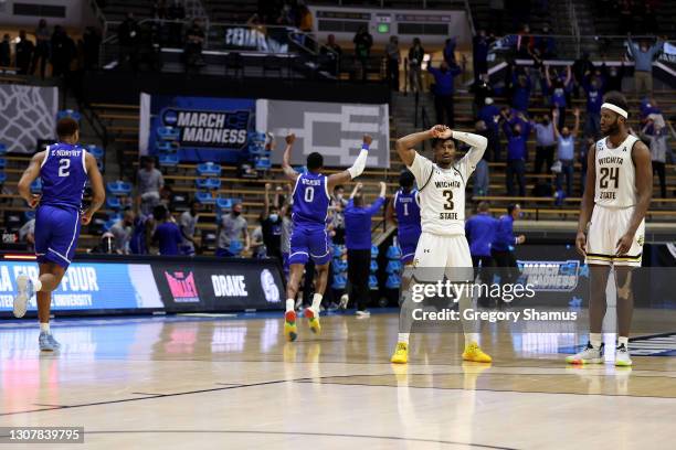 Alterique Gilbert of the Wichita State Shockers and Morris Udeze react after losing to the Drake Bulldogs in the First Four game prior to the NCAA...