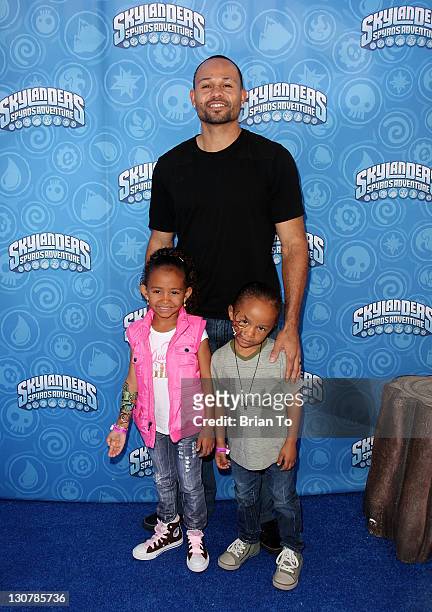 Athlete Coco Crisp and children attend Activision's "Skylanders Spyro's Adventure" Halloween-themed event at The Grove on October 29, 2011 in Los...