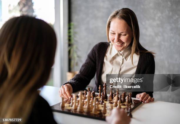 Two business women play chess hi-res stock photography and images - Alamy