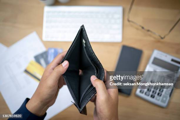 hand open empty purse looking for money having problem bankrupt broke - wallet ストックフォトと画像