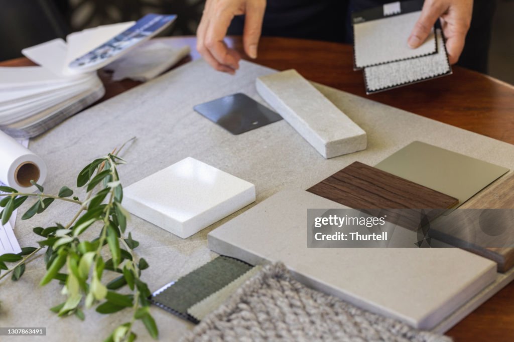 Designer Laying Out A Sample Board