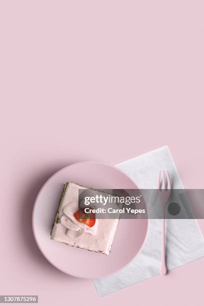 slice of strawberry cake in pink plate and pink surface.top view - bright food stock pictures, royalty-free photos & images