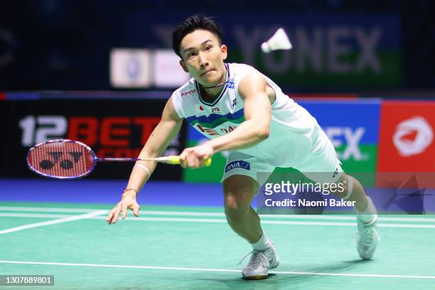 Kento Momota of Japan returns a shot during his round of 16 match against Prannoy H. S. During day two of YONEX All England Open Badminton...