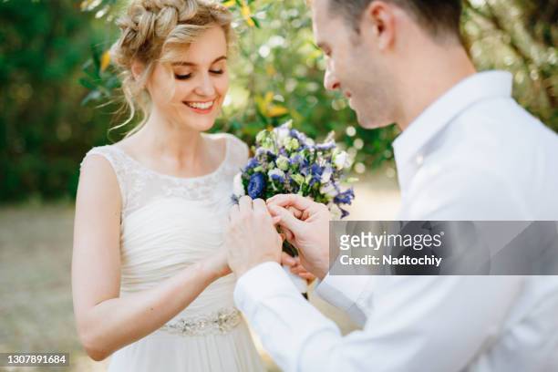 close-up of bridegroom during wedding ceremony - wedding ceremony stock-fotos und bilder