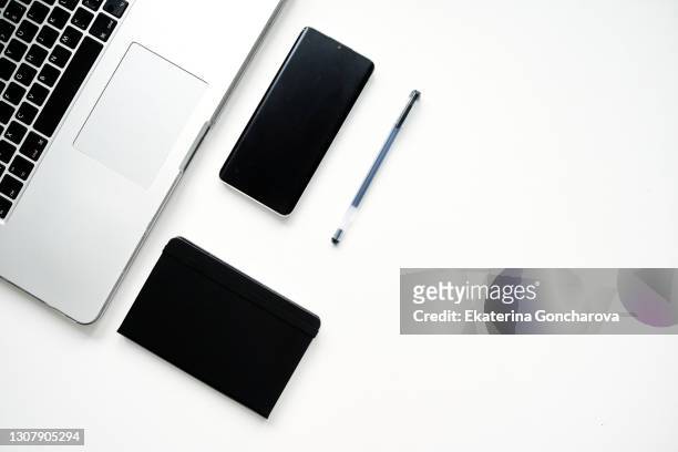 layout of business tools for demonstrating a business concept on a white table. - laptop on white background stock pictures, royalty-free photos & images