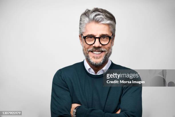 hispanic male entrepreneur against white background - mature men stock pictures, royalty-free photos & images