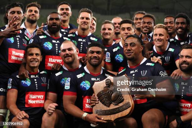 The Rebels pose with the Weary Dunlop Shield after victory in the round five Super RugbyAU match between the Melbourne Rebels and the NSW Waratahs at...