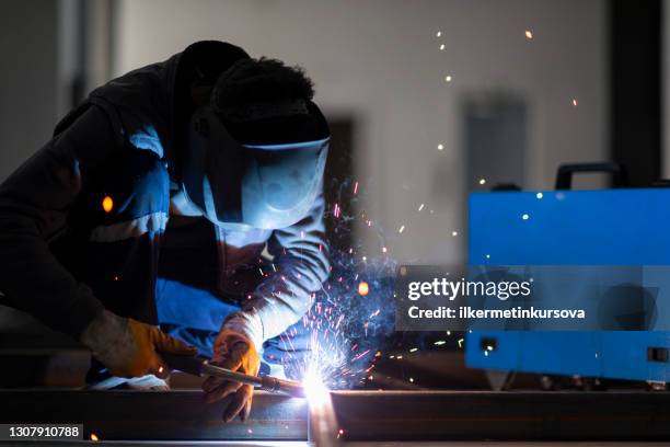a worker is doing gas welding - migrant worker stock pictures, royalty-free photos & images